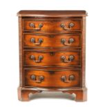 A 20TH CENTURY MAHOGANY SERPENTINE CHEST OF DRAWERS