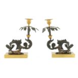 A PAIR OF LATE 19TH CENTURY REGENCY STYLE BRONZE AND GILT BRONZE CANDLESTICKS