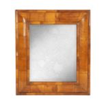 A WILLIAM AND MARY WALNUT CUSHION FRAMED HANGING MIRROR