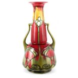 A LATE 19TH CENTURY MINTON SECESSIONIST WARE SHAPED TWO HANDLED CABINET VASE WITH TALL TAPERING NECK