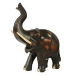 A LATE 19TH CENTURY ANGLO INDIAN CARVED EBONY ELEPHANT