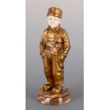 A FRENCH ART DECO GILT BRONZE AND IVORY SCULPTURE OF A YOUNG DUTCH BOY BY JOSEPH D’ ASTE (1881 -