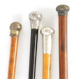 A COLLECTION OF THREE SILVER MOUNTED HORN HANDLED WALKING STICK