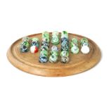 A VICTORIAN ELM SOLITAIRE BOARD AND MARBLES