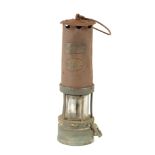 A 19TH CENTURY BRASS AND IRON MINERS LAMP