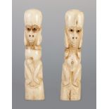 A PAIR OF AFRICAN CARVED BONE FERTILITY FIGURES