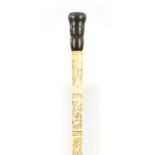 A LATE 19TH CENTURY / EARLY 20TH CENTURY ORIENTAL ENGRAVED SEGMENTED BONE AND HORN WALKING STICK