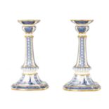 A RARE PAIR OF ROYAL CROWN DERBY BLUE AND WHITE CANDLESTICKS