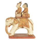 AN EARLY 20TH CENTURY CARVED INDIAN ELEPHANT