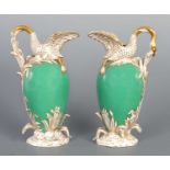 A PAIR OF 19TH CENTURY PORCELAIN EWERS