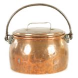 AN 18TH CENTURY IRON AND COPPER OVAL LIDDED COOKING POT