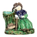 A 19TH CENTURY MAJOLICA FIGURAL SPILL VASE