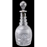 A SILVER MOUNTED GLASS CUT DECANTER with bulbous stopper - London 1908 31cm high.