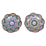 TWO 19TH CENTURY ISNIC ENAMELED DISHES having scalloped edges with birds, flowers, and geometric
