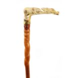A 19TH CENTURY CARVED ANTLER HORN WALKING STICK