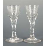 A PAIR OF REGENCY CUT GLASS WINE GLASSES