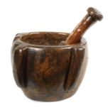 AN EARLY 16TH/17TH CENTURY BURR WALNUT PESTLE AND MORTAR