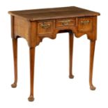 AN EARLY 18TH CENTURY HERRING-BANDED FIGURED WALUT LOWBOY