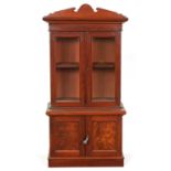 A MID 19TH CENTURY MAHOGANY MINIATURE GLAZED BOOKCASE