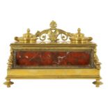 A 19TH CENTURY BRASS AND ROUGE MARBLE DESK STAND