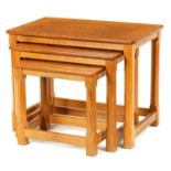 A SET OF THREE 20TH CENTURY OAK ROBERT ‘MOUSEMAN’ THOMPSON GRADUATED COFFEE/OCCASIONAL TABLES