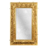 A 19TH CENTURY CARVED ITALIAN GILT WOOD MIRROR OF LARGE SIZE