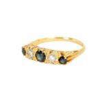 AN 18CT GOLD FIVE STONE DIAMOND AND SAPPHIRE RING