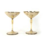 A PAIR OF EARLY 20TH CENTURY SILVER AND CARVED IVORY CHALICES BY M.T. WETZLAR