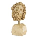 AN EARLY CARVED CARRERA MARBLE HEAD OF A CLASSICAL BEARDED GENTLEMAN