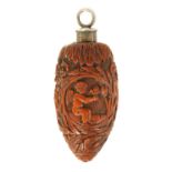 A FINELY CARVED 19TH CENTURY FRENCH COQUILLA NUT SCENT FLASK