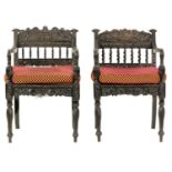 A MATCHED PAIR OF 18TH CENTURY ANGLO PORTUGUESE EBONY ARMCHAIRS