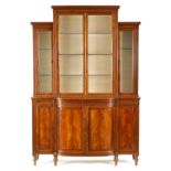 A GEORGE III SHERATON STYLE FIDDLE-BACK MAHOGANY BREAKFRONT BOOKCASE OF SMALL SIZE AND PROPORTIONS