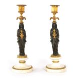 A FINE PAIR OF REGENCY FIGURAL BRONZE AND ORMOLU CANDLESTICKS