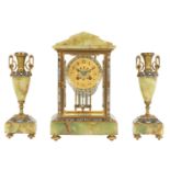A LATE 19TH CENTURY FRENCH CHAMPLEVE ENAMEL, BRASS AND ONYX CLOCK GARNITURE