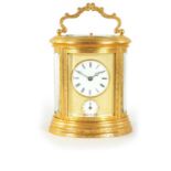 A LATE 19TH CENTURY OVAL ENGRAVED GILT BRASS REPEATING CARRIAGE CLOCK