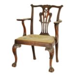 A MID 18TH CENTURY WALNUT OPEN ARMCHAIR IN THE MANNER OF CHIPPENDALE