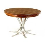 A 1960’S DANISH FIGURED ROSEWOOD ‘FLIP-FLAP’ EXTENDING CIRCULAR DINING TABLE BY DYRLUND