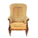 AN EARLY 19TH CENTURY REGENCY MAHOGANY UPHOLSTERED LIBRARY CHAIR OF GENEROUS SIZE