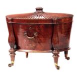 A FINE GEORGE III 'HEPPLEWHITE' MAHOGANY OVAL CELLARETTE/WINE COOLER OF GENEROUS SIZE