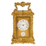 A FINE MID 19TH CENTURY GILT BRASS FRENCH ROCOCO REPEATING CARRIAGE CLOCK WITH ALARM OF SMALL SIZE -