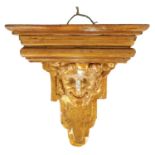 AN 18TH CENTURY FRENCH CARVED MASK HEAD GILT GESSO WALL MOUNTED HANGING BRACKET