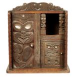 A MID 20TH CENTURY NEW ZEALAND MAOIRE CARVED HARDWOOD CABINET