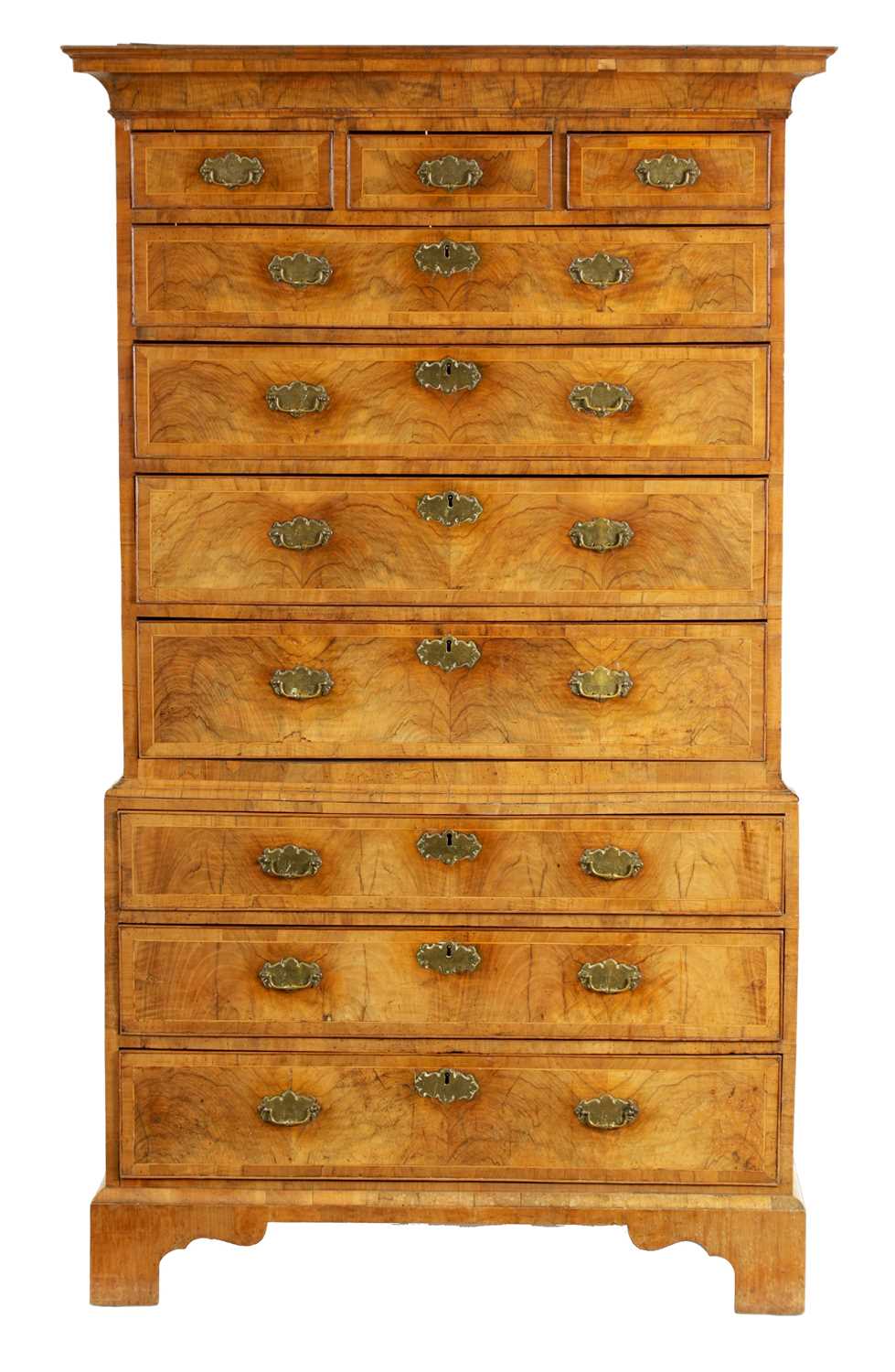 A GEORGE I FIGURED WALNUT CHEST ON CHEST