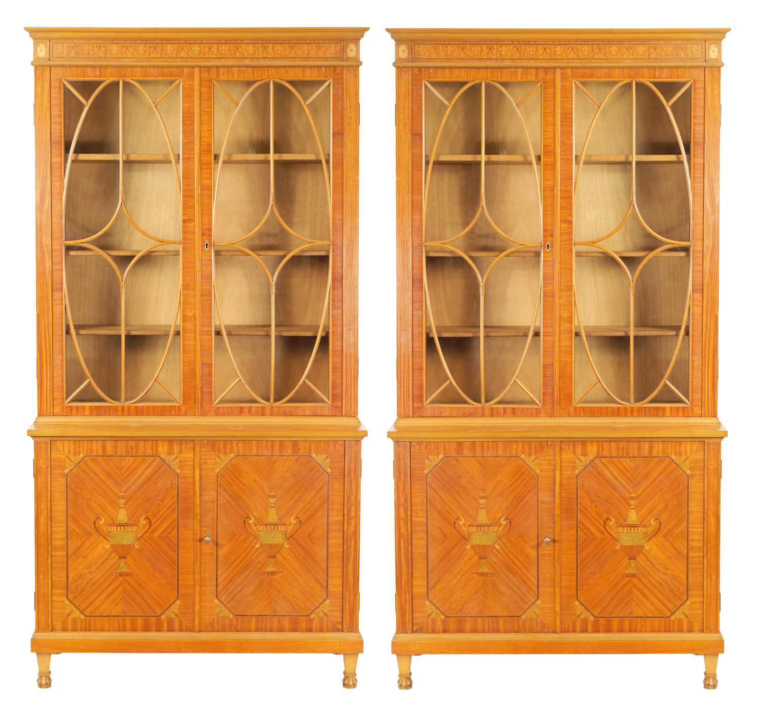 MAPLE & CO. A PAIR OF EDWARDIAN FIGURED SATINWOOD AND MARQUETRY INLAID GLAZED BOOKCASES