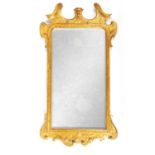 A GEORGE II GILT GESSO CARVED WOOD HANGING MIRROR