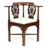 AN EARLY GEORGE III CHIPPENDALE DESIGN MAHOGANY CORNER CHAIR
