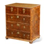 AN UNUSUAL WILLIAM AND MARY OYSTERED LABURNUM CHEST OF DRAWERS