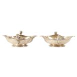 AN IMPORTANT AND RARE PAIR OF GEORGE I CAST SILVER DOUBLE LIPPED SAUCE BOATS BY PIERRE PLATEL DATED