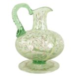 AN 18TH/19TH CENTURY CONTINENTAL PALE GREEN GLASS EWER