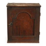 A WILLIAM AND MARY WALNUT AND ELM HANGING SPICE CUPBOARD